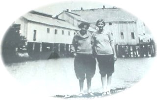 image of two ol gals in front of the Port Renfrew Cannery 